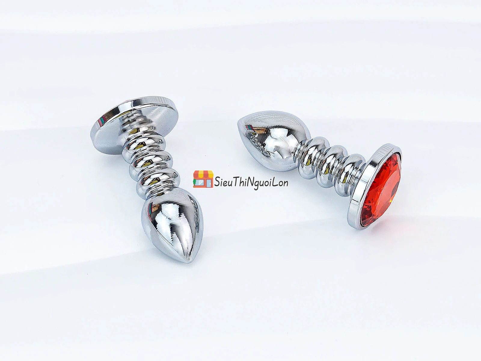 Đồ chơi kích hậu Inox xoắn ốc đuôi pha lê màu cam