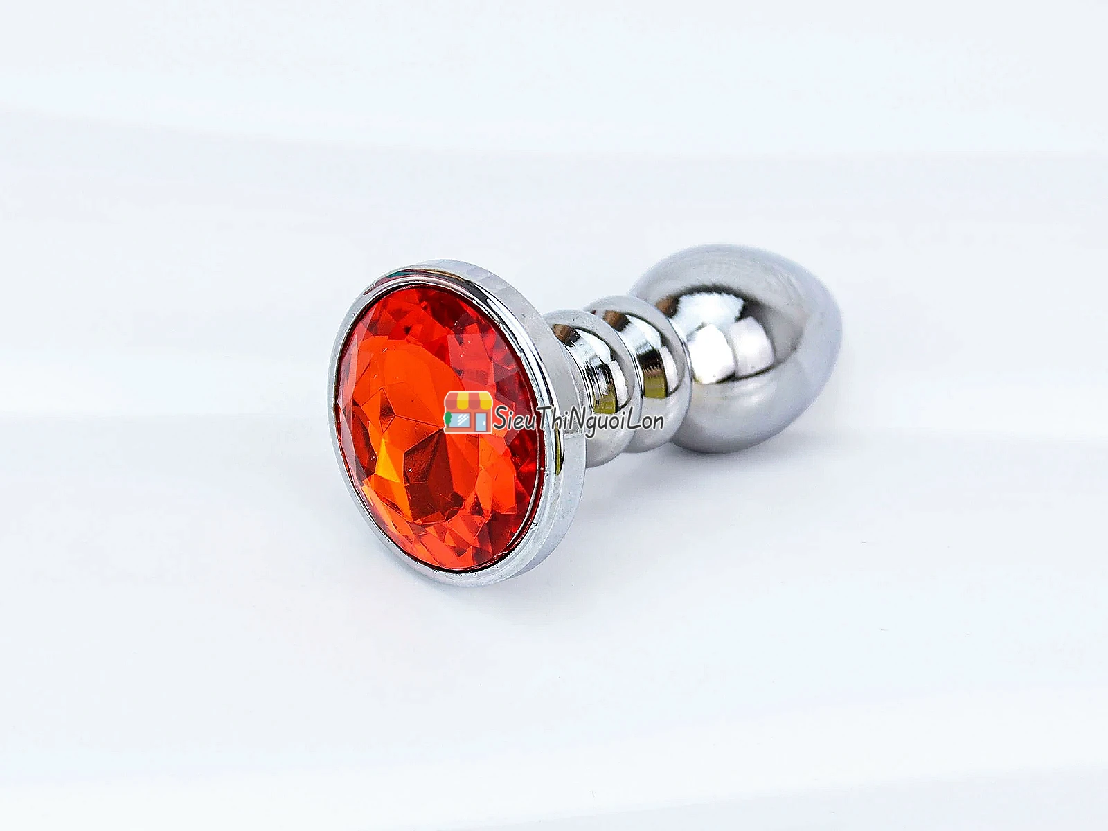 Đồ chơi kích hậu Inox xoắn ốc đuôi pha lê màu cam