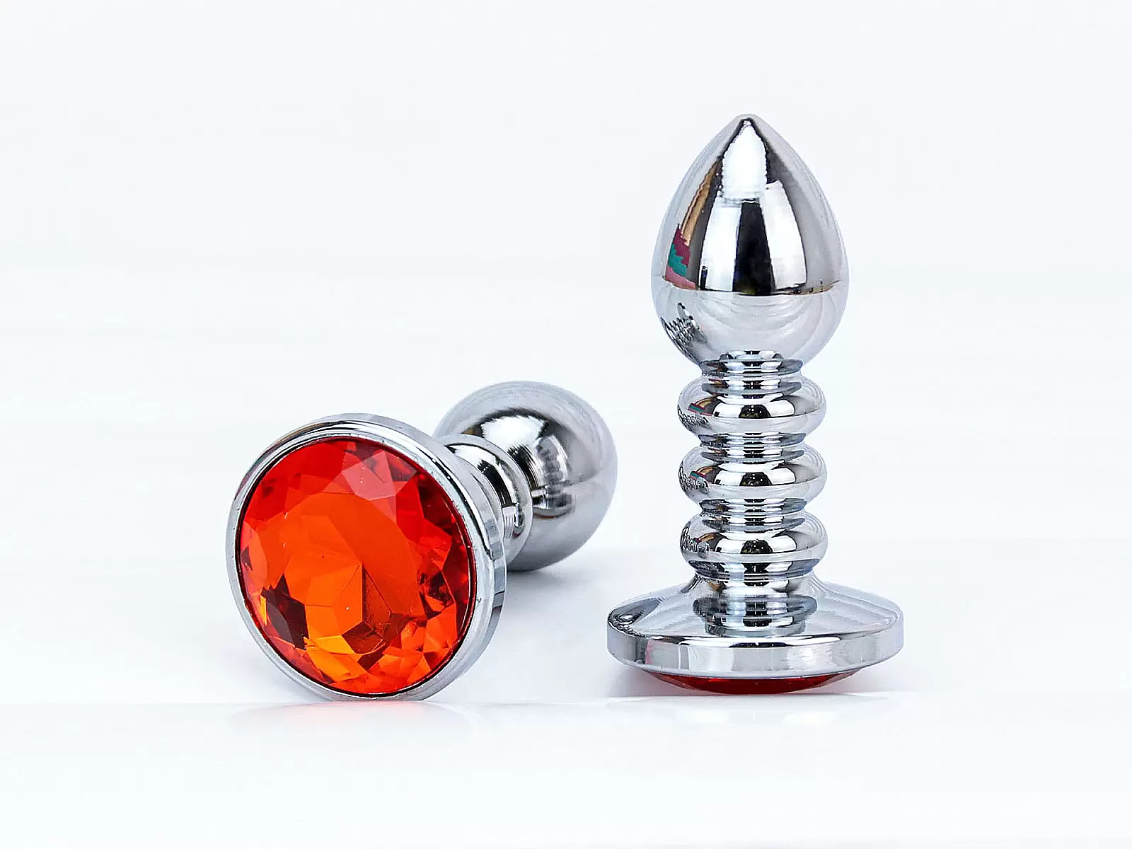 Đồ chơi kích hậu Inox xoắn ốc đuôi pha lê màu cam